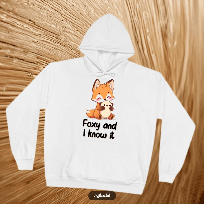 Funny Fox Submission Hoodie featuring a curious fox practicing a submission hold on a plush toy, cozy and a funny gift.
