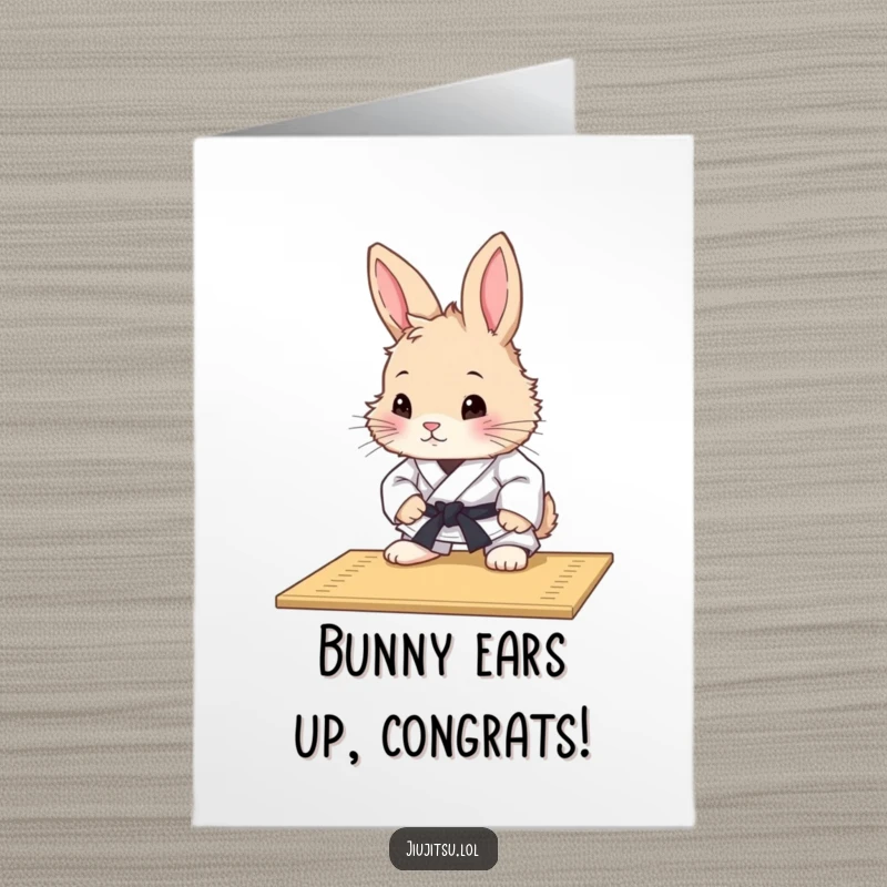 Funny Free Printable Congratulations Card: A curious, fluffy rabbit in a judo uniform contemplates a mat. Cute downloadable art.